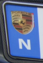 Norway close-up of blue band with a Porche logo.jpg (17 kB)
